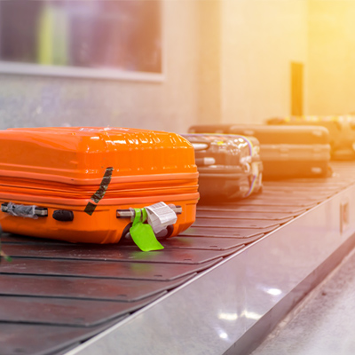 Suitcases on luggage belt Suitcases on luggage belt